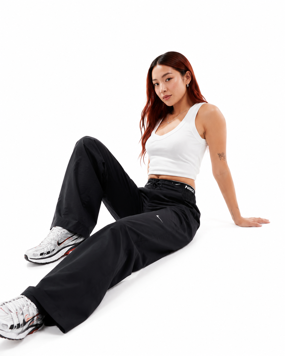 شلوار تگدار زنانه نایکی Sportswear Essentials Woven فاق بلند اورجینال | FB8284-010