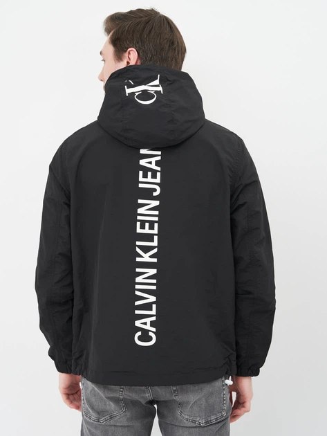 کاپشن سبک و کلاه‌دار مردانه Calvin Klein Jeans مشکی – لوگو چاپی پشت